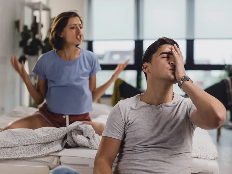 images/blog/young-man-feeling-stressed-out-having-headache-while-his-girlfriend-is-arguing-with-him-bedroom.webp