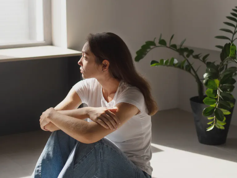 images/blog/portrait-young-woman-with-low-self-esteem-sitting-by-window-home.webp