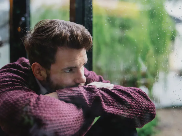 images/blog/thoughtful-man-looking-out-window.webp